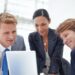 Do employers have to provide health insurance business professionals discussing coverage options.